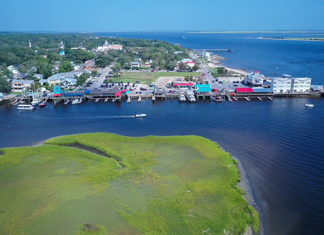 Southport, NC - Aerial View of Southport, NC With Speed Boats